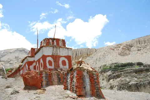 chorten with prayer wheel